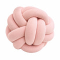 Cojín decorativo redondo 30 cm de tejido rosa con nudo y textura acanalada